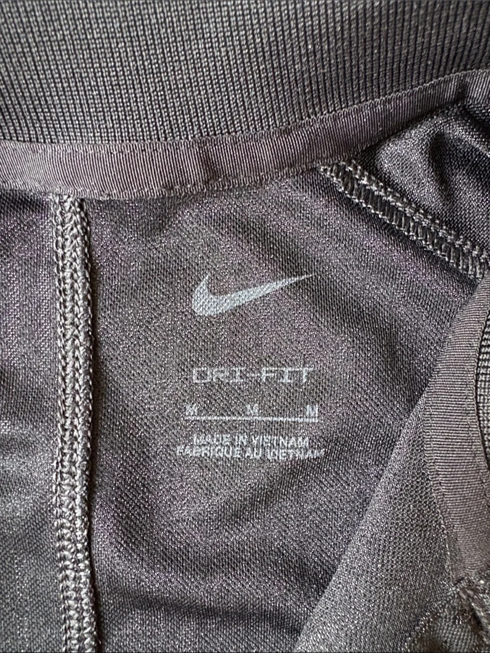 Nike Black Short-Sleeve Performance Polo with White Swoosh